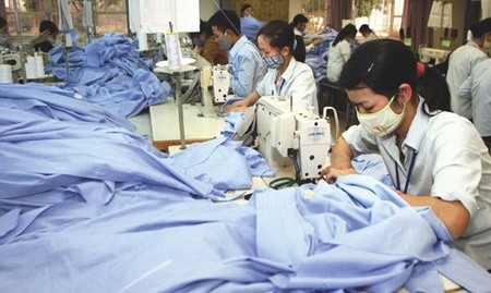 Textile workers in Thanh Hoa Province manufacture clothes for export. The National Wage Council will ask the Prime Minister for an average increase of 15.1 per cent in regional-based minimum wages next year. — VNA/VNS Photo Tran Viet. Textile workers in Thanh Hoa Province manufacture clothes for export. The National Wage Council will ask the Prime Minister for an average increase of 15.1 per cent in regional-based minimum wages next year. — VNA/VNS Photo Tran Viet.